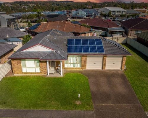 An aerial view of a house with solar panels on the roof located at 4 Karong Avenue in Maryland.